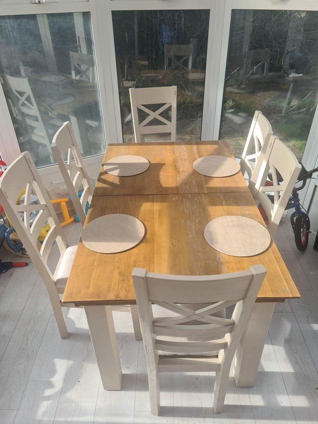 Preview of the first image of Oak Furniture land table with 6 chairs.