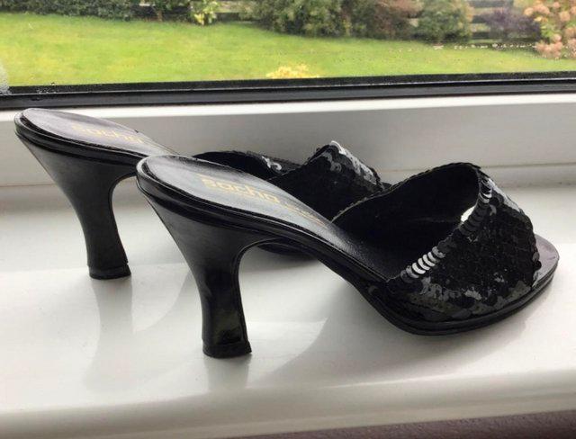 Preview of the first image of NEW black sequins, high heel, slip on ladies shoes.