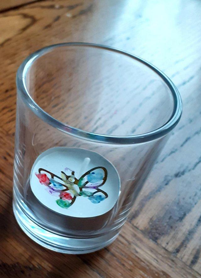 Preview of the first image of Hand  painted  glass  holders  for  tea light  or pens.