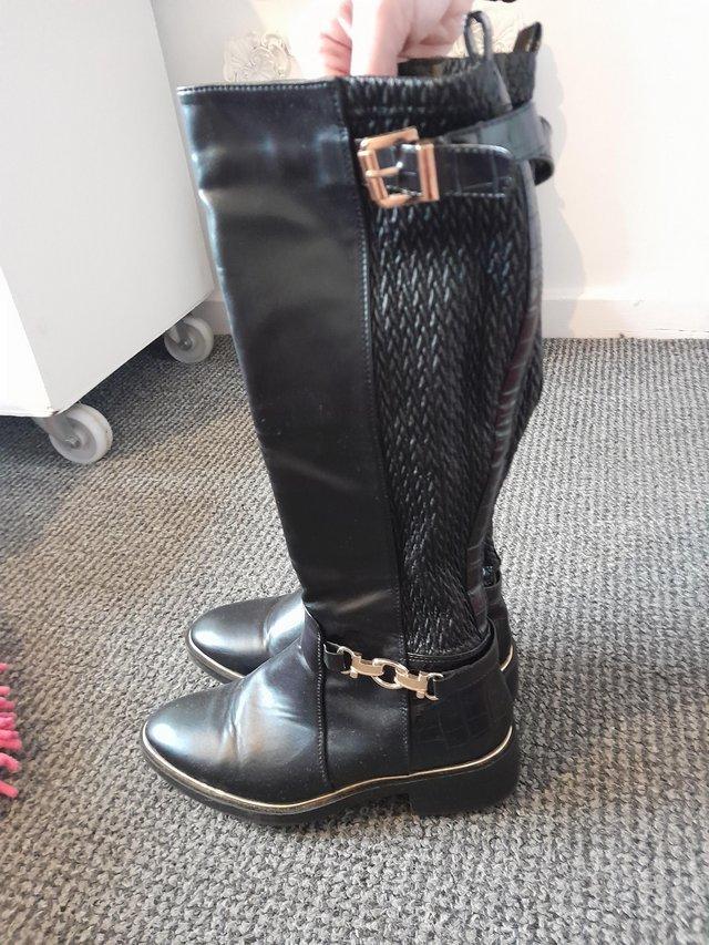 Preview of the first image of Womens or kids long black boots.