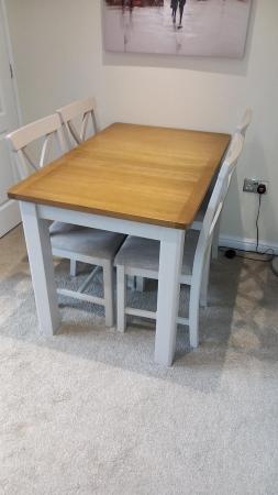 Image 1 of Extending table and four chairs.