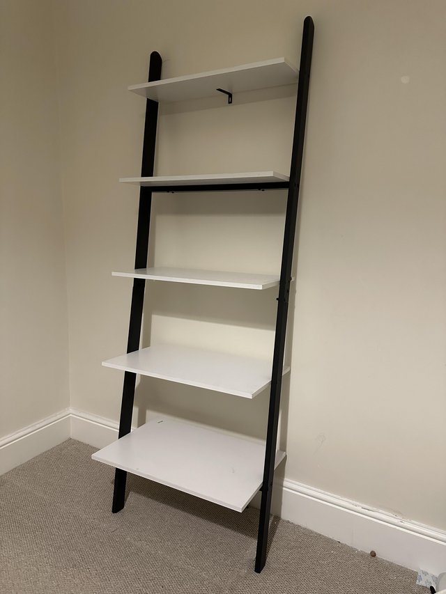 Preview of the first image of Ladder Shelf Metal Frame - black frame and white shelves.
