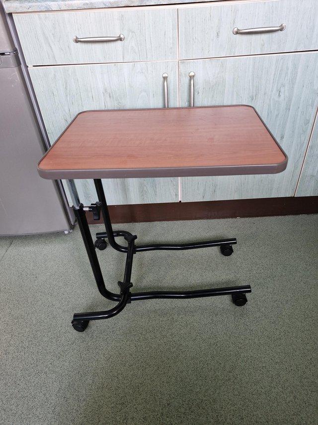 Preview of the first image of NRS Healthcare Overbed and chair table.