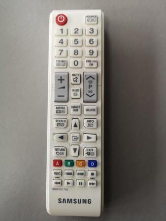 Image 1 of Samsung TV remote control and power supply.