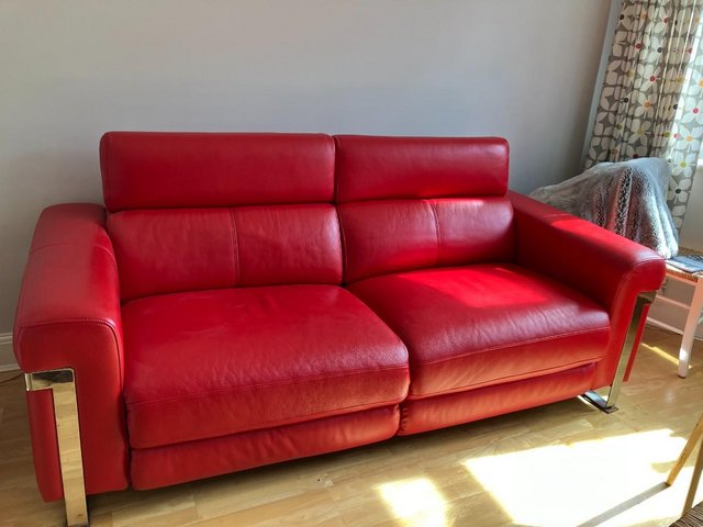 Preview of the first image of Red leather 3 seater headrest sofa in excellent condition.