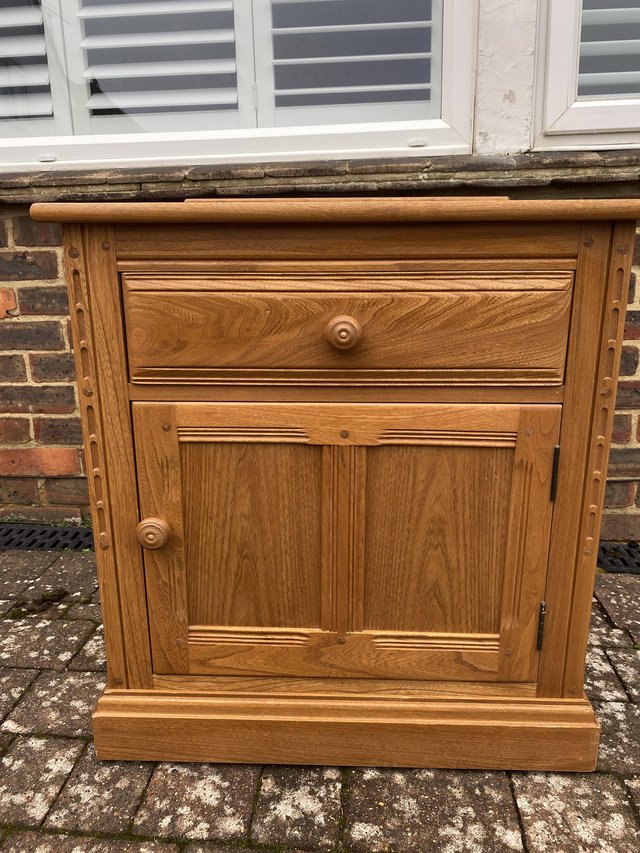 Preview of the first image of Ercol Mural Light Elm Low Cabinet With Cutlery Drawer.