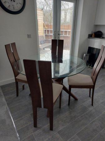 Image 1 of Modern glass topped dining table and 4 chairs