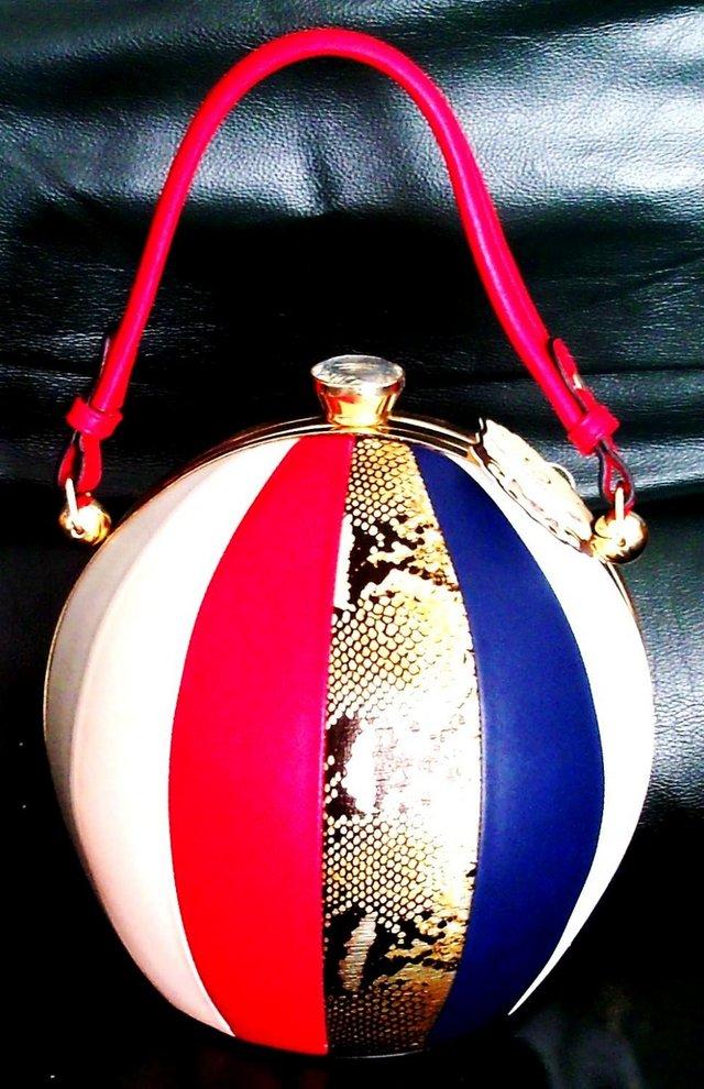 Preview of the first image of STUNNING NWT UNUSUAL ROUND HANDBAG..