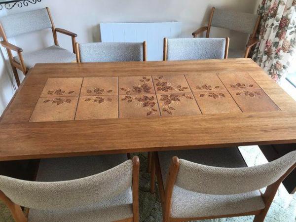 Image 1 of Polished wood extendable dining room table and 6 chairs
