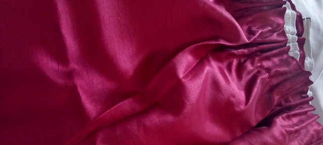 Image 1 of Dark red lined curtains.