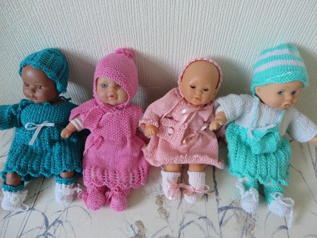 Preview of the first image of dolls all soft bodied in new clothes.