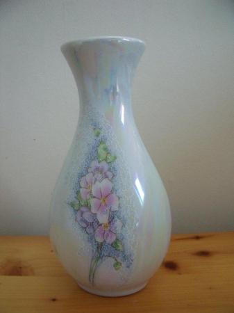 Image 1 of Iridescent ceramic vase with delicate lilac flower design.