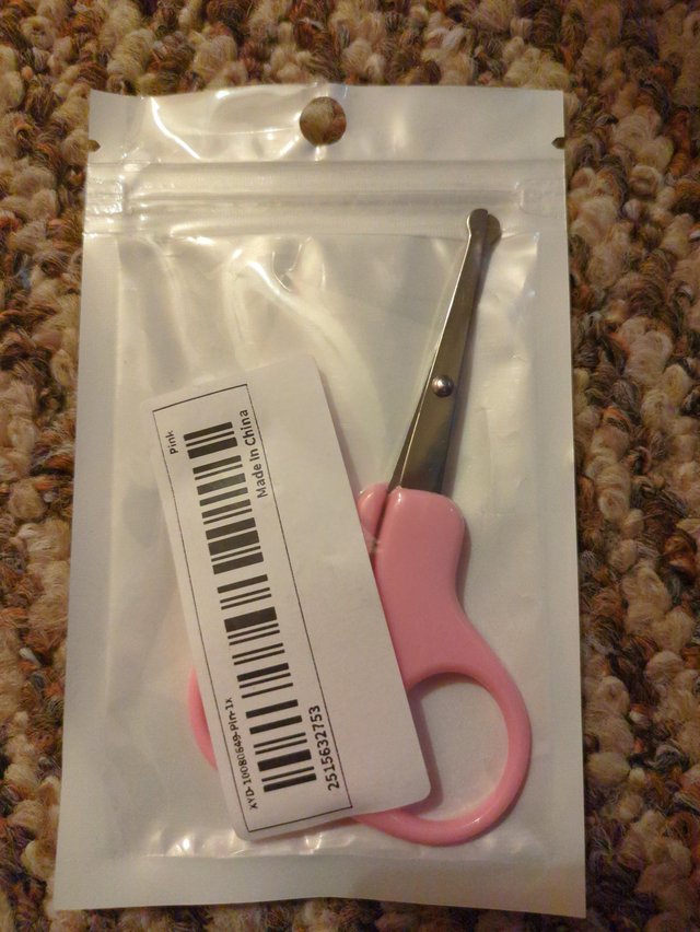 Preview of the first image of New...baby scissors ..never used.