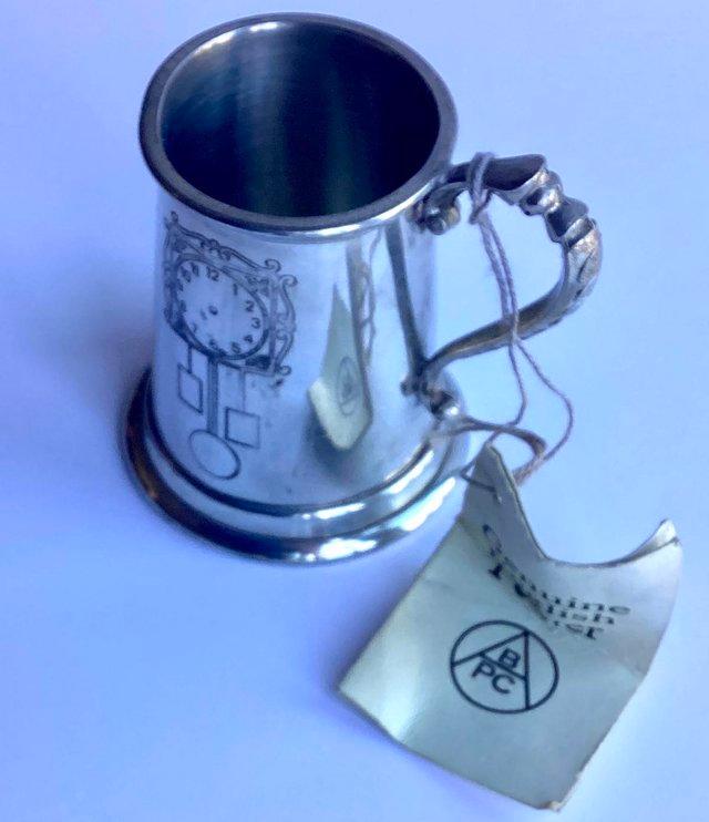 Preview of the first image of Genuine Pewter Tankard with Engraved Clock.