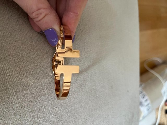 Preview of the first image of Rose Gold coloured T-bar hinged bracelet.