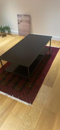 Image 1 of IKEA black glass table. 2 years old