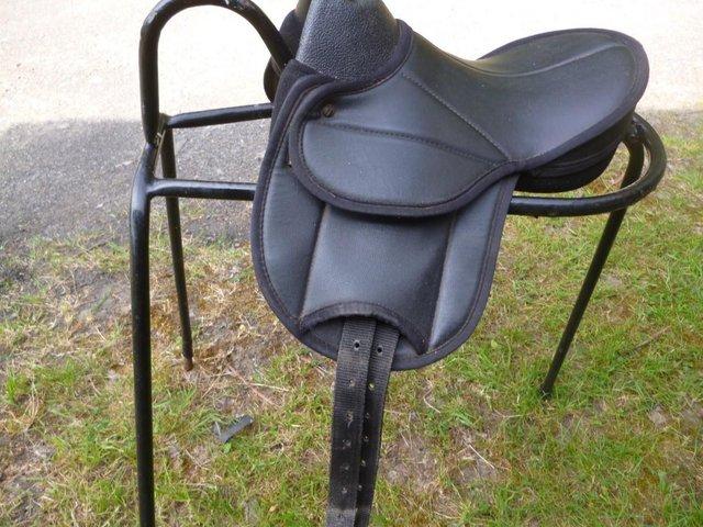 Preview of the first image of Black 12" Small Childs synthetic saddle.