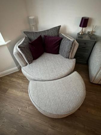 Image 2 of Large swivel snuggle chair and half moon footstool