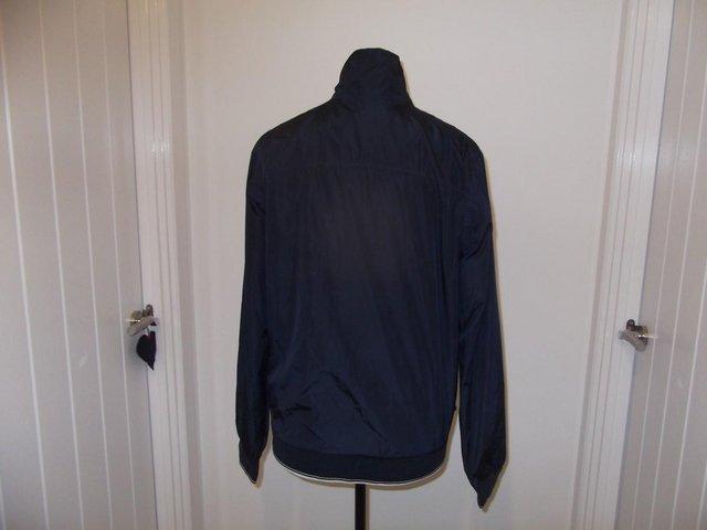 Preview of the first image of Musto shower proof jacket - size 12.