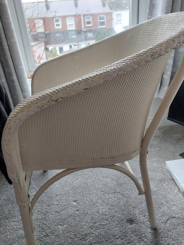 Preview of the first image of White wicker chair. Comfort seat.  General wear and tear.
