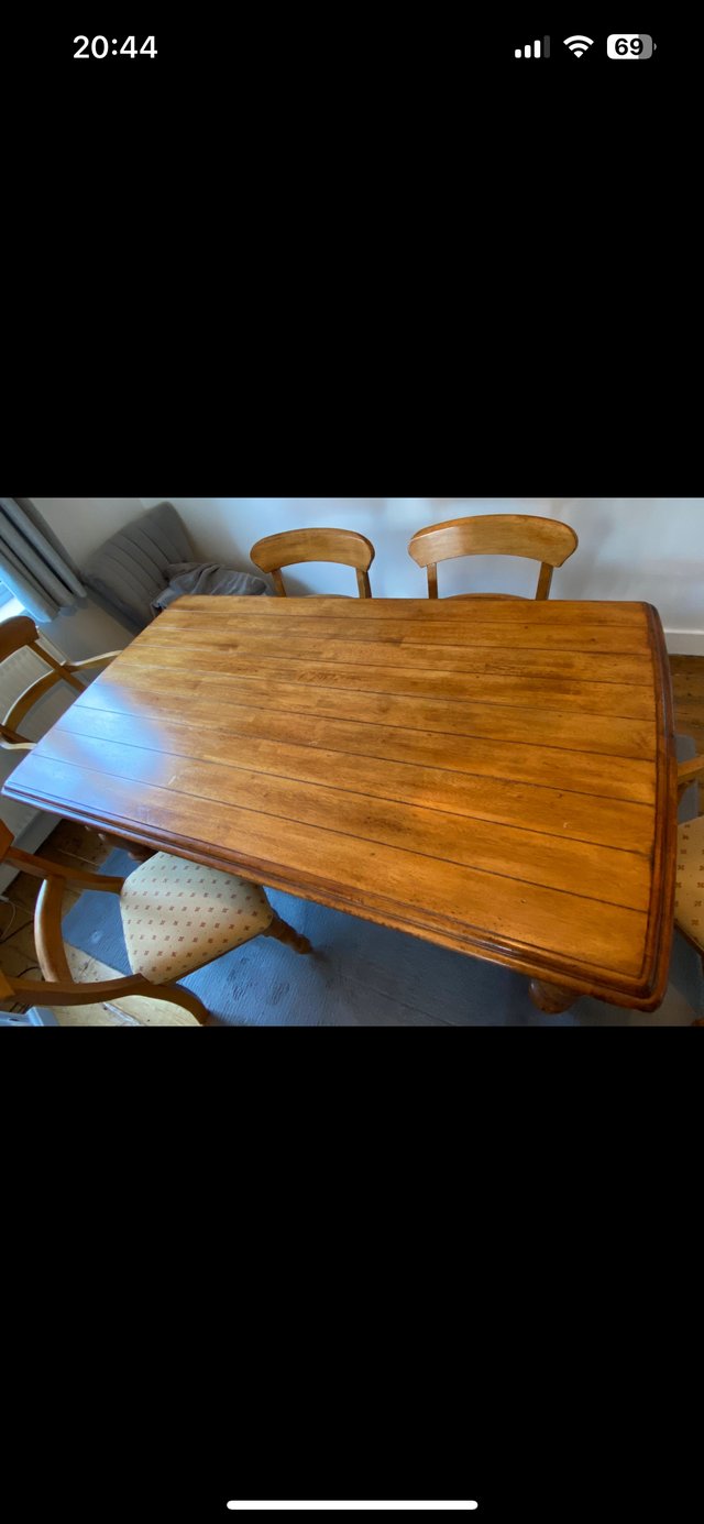 Preview of the first image of Farmhouse solid wood dining table and 8 dining chairs.