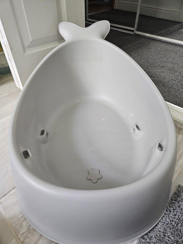 Preview of the first image of Skip Hop Moby Smart Sling 3 Stage Bathtub.