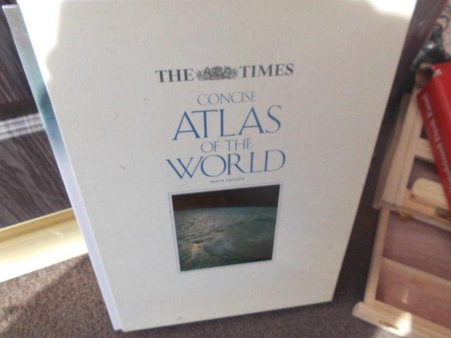 Preview of the first image of atlas of the world in book case.