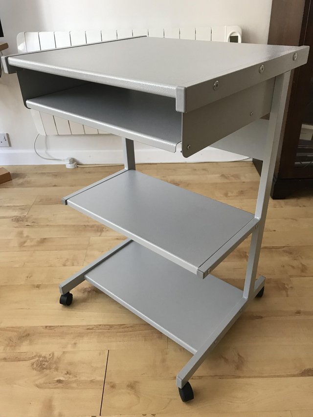 Preview of the first image of Grey metal computer desk unit with storage shelves..