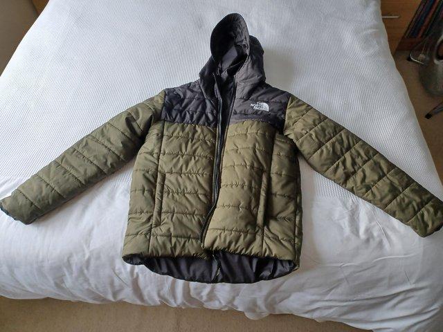 Preview of the first image of Boys North Face reversible coat.