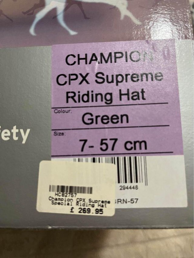 Preview of the first image of Champion CPX Supreme Riding hat green size 7.