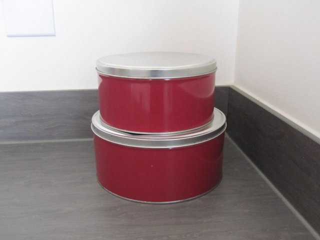 Preview of the first image of Two red kitchen cake tins small and medium.