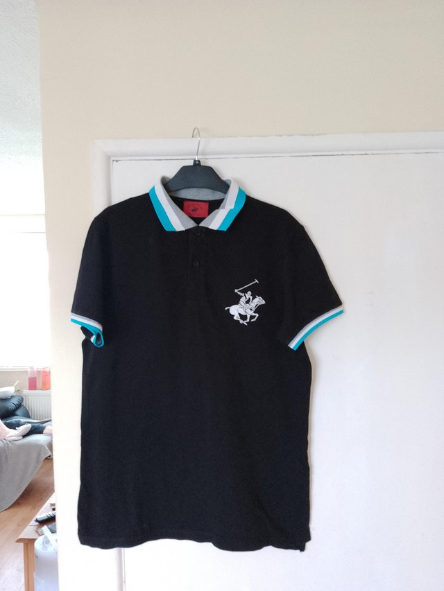 Preview of the first image of Polo top size 12 excellent condition.