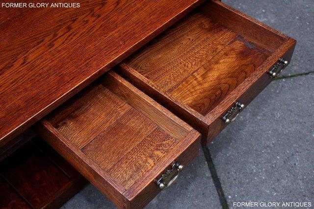 Image 33 of TAYLOR & Co STRESSED OAK THREE DRAWER POTBOARD COFFEE TABLE