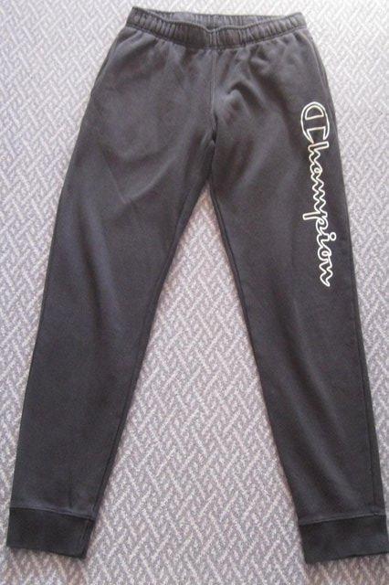 Preview of the first image of Boys/Mens Black Champion Joggers, size S..