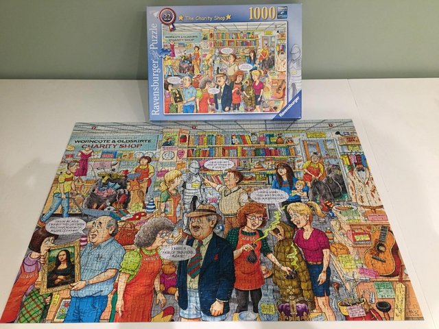 Preview of the first image of Ravensburger 1000 piece jigsaw titled The Charity Shop..