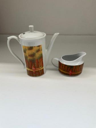 Image 3 of a coffee pot and a milk/cream pot after Botero