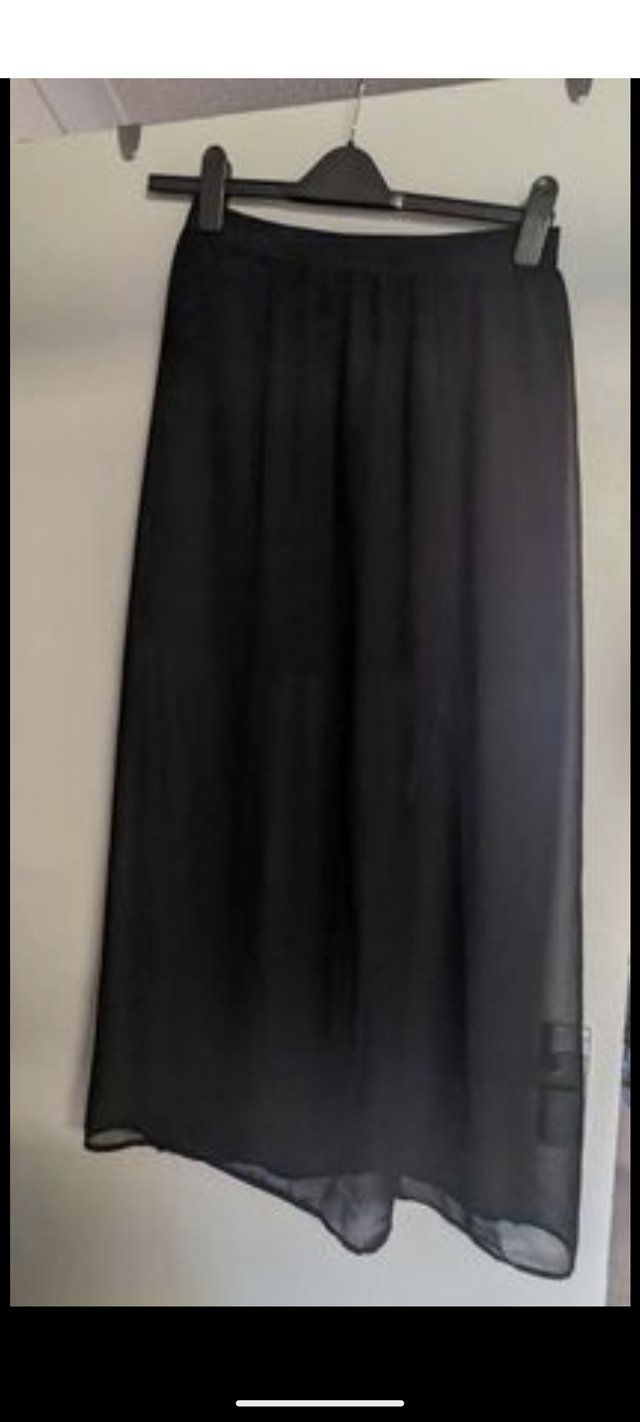 Preview of the first image of H&M sheer black maxi skirt, excellent condition size 12.