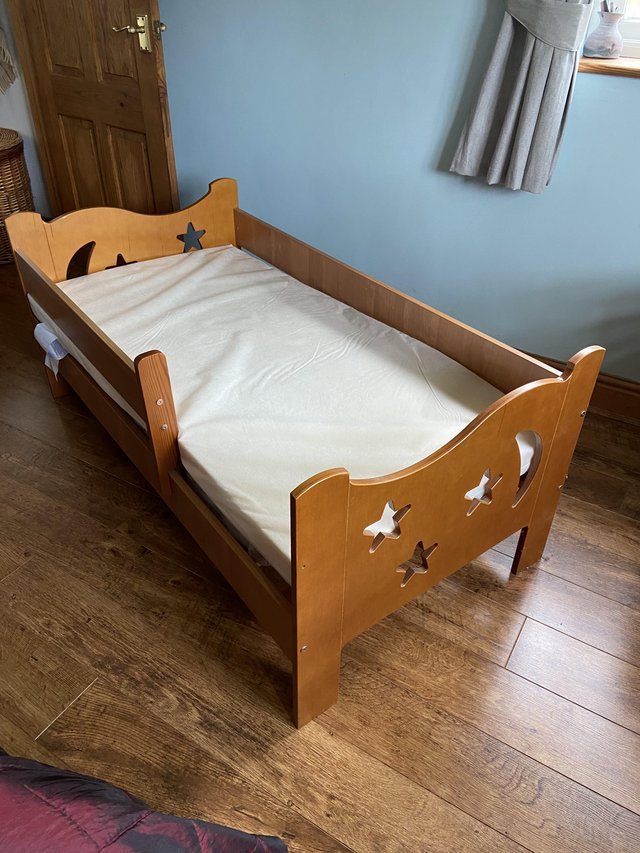 Preview of the first image of Wooden childs bed with mattress.