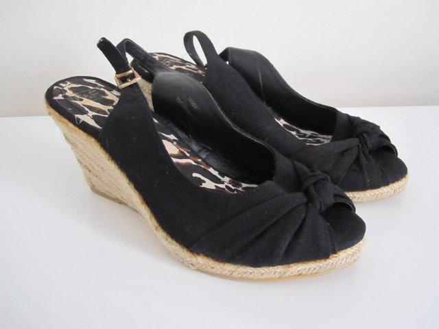 Preview of the first image of Ladies wedge sandals size 5 like new.