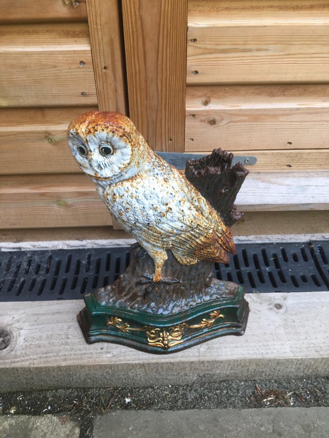 Preview of the first image of A cast iron barn owl door stop..
