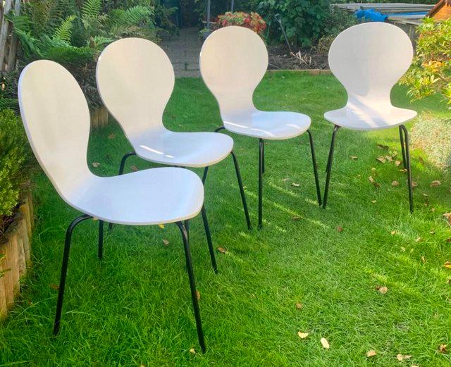 Preview of the first image of A set of four modern kitchen dining chairs..