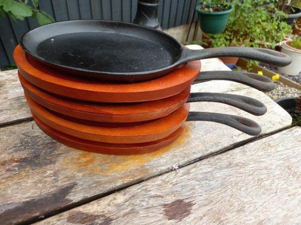 Image 3 of 4 iron skillett sizzler pans with wooden shaped tray to fit