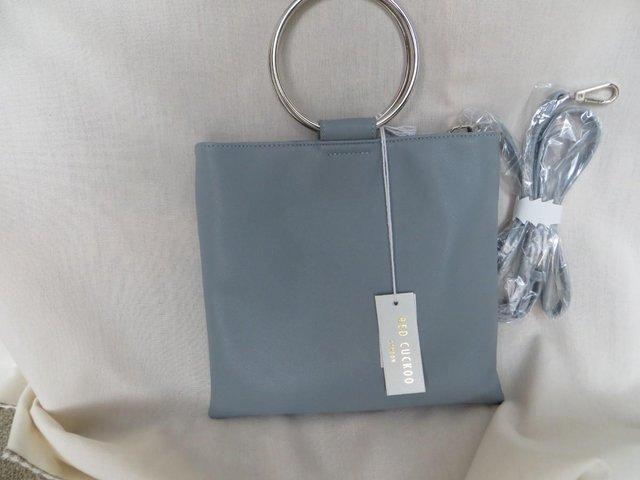 Preview of the first image of Red Cuckoo Grey Colour Handbag.