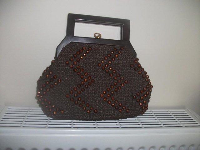 Preview of the first image of VINTAGE BROWN BEADED HANDBAG (clasp).