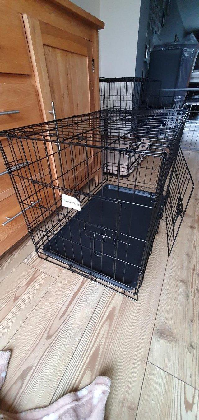 Preview of the first image of As New Dog Crate - Medium 76 cm L x 46 cm W x 51 cm H.