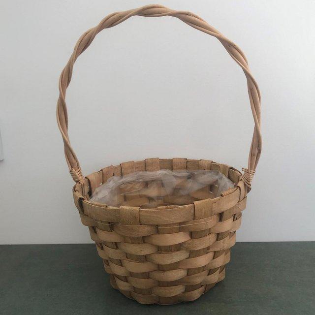 Preview of the first image of Large basket with handle, plastic lined. For collection..