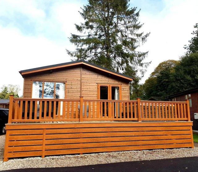 Preview of the first image of Exquisite Three Bedroom Lakeside Lodge with Hot Tub.