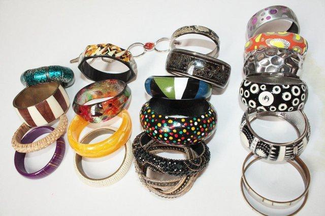 Preview of the first image of Women's 22 Assorted Bangles. Made of assorted materials..
