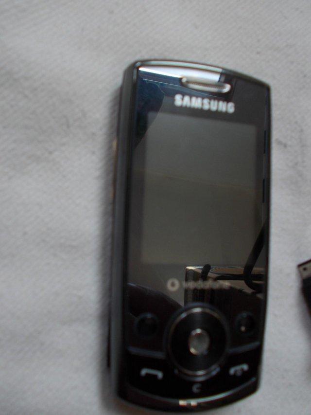 Preview of the first image of Samsung SGH J700V mobile phone + charger on Vodafone.