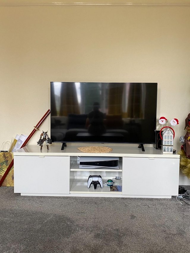 Preview of the first image of TV stand with storage in perfect condition. Selling because.